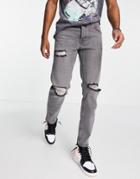 Asos Design Tapered Jeans In Washed Black With Knee Rips