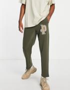 Puma Varsity Logo Sweatpants In Green