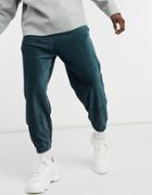 Asos Design Coordinating Oversized Sweatpants In Velour Corduroy-green