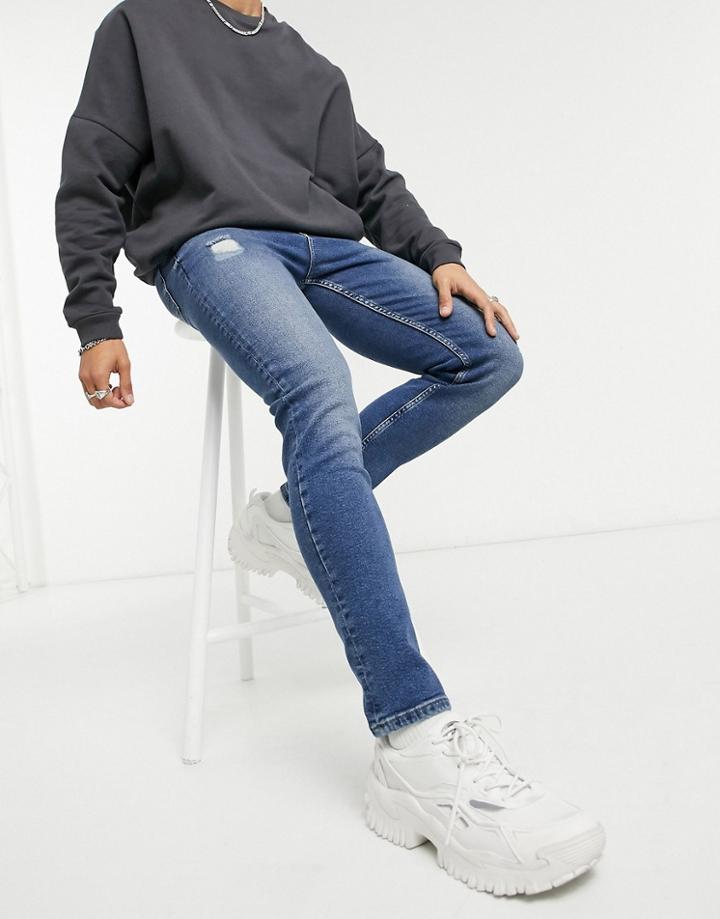 Asos Design Vintage Look Skinny Jeans In Dark Wash Blue With Abrasions