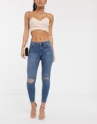 Asos Design Lisbon Mid Rise Jeans In Mid Wash Blue With Frayed Knee Rips