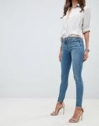 Asos Design Whitby Low Waist Skinny Jeans In Mid Stonewash Blue - Blue