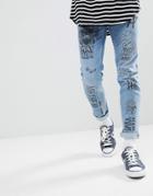 Asos Skinny Jeans In Mid Wash Blue With All Over Grunge Prints - Blue