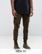 Asos Tapered Joggers With Rips And Zip Pockets In Brown - Brown