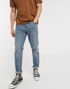 Asos Design Stretch Tapered Jeans In Mid Wash Blue-blues