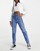 Levi's High Waisted Ripped Mom Jean In Mid Wash-blues