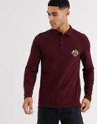 Asos Design Long Sleeve Pique Polo With Chest Emblem Print In Burgundy-purple