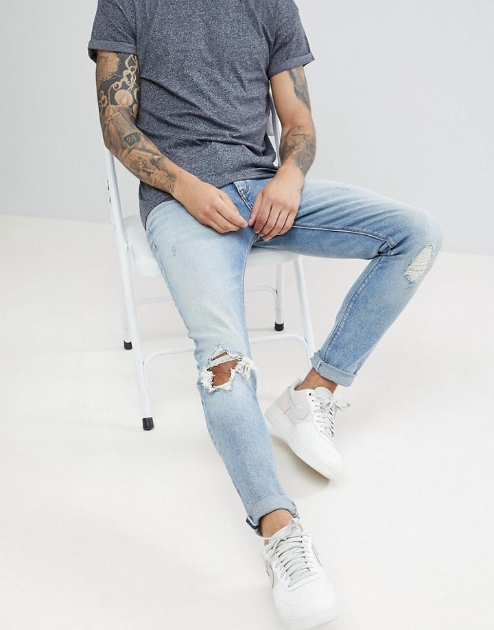 Asos Skinny Jeans In Vintage Light Wash Blue With Rips - Blue