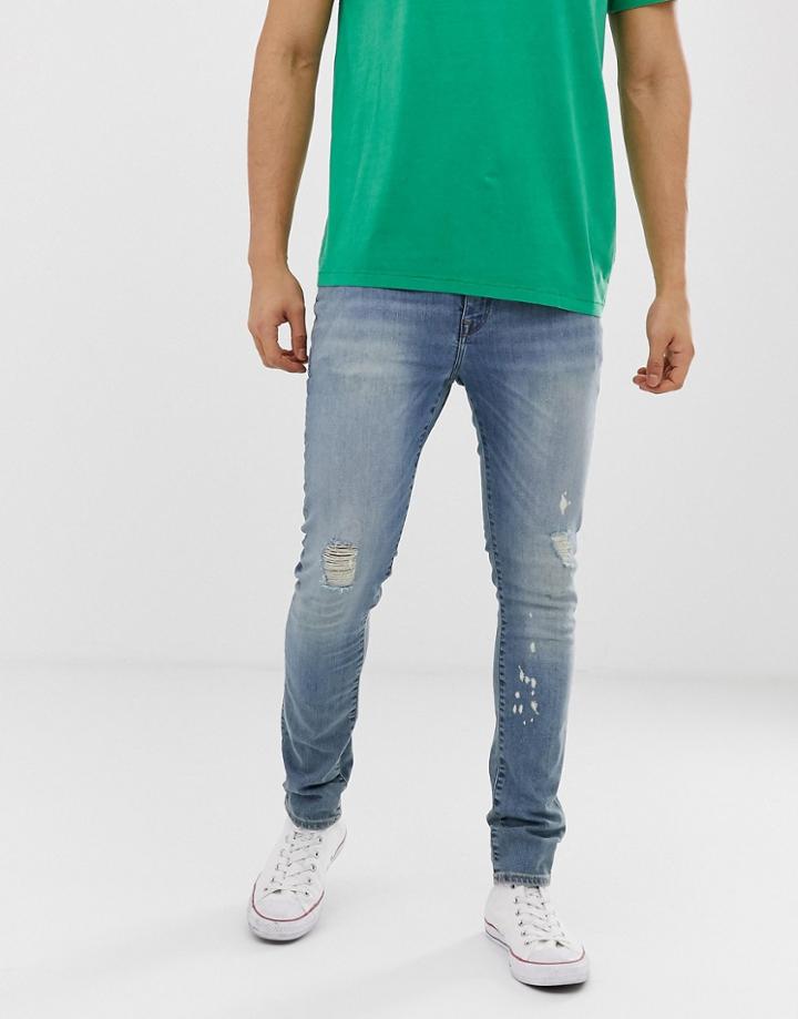 Asos Design 12.5oz Super Skinny Jeans In Vintage Mid Wash Blue With Abrasions