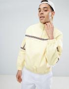 Asos Design Festival Denim Windbreaker With Pom Poms In Yellow - Yellow