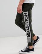 Hollister Print Logo Camo Print Skinny Joggers In Olive Green - Green