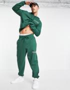 Asos Design Oversized Sweatpants In Dark Green With Wellness Text Print - Part Of A Set