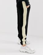 Asos Design Tapered Sweatpants In Borg With Side Stripe In Black - Black