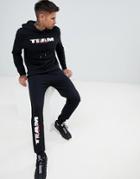 Asos Design Tracksuit Hoodie/skinny Joggers With Team Turnt Text Print - Black