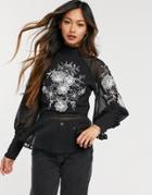 Asos Design Long Sleeve High Neck Sheer Top With Contrast Embroidery In Black