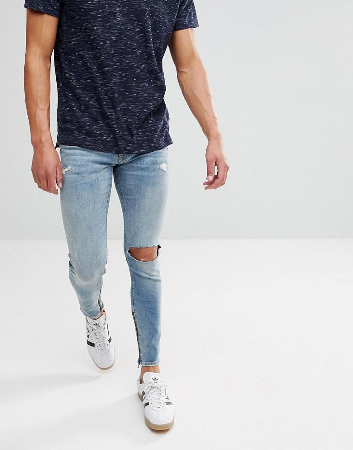 Jack & Jones Intelligence Jeans In Skinny Fit With Distress And Zip Ankle - Blue