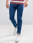 Wrangler Tapered Jeans In Rinse Wash - Blue