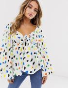 Asos Design Top With Volume Long Sleeve And Tie Front In Splodge Print-multi