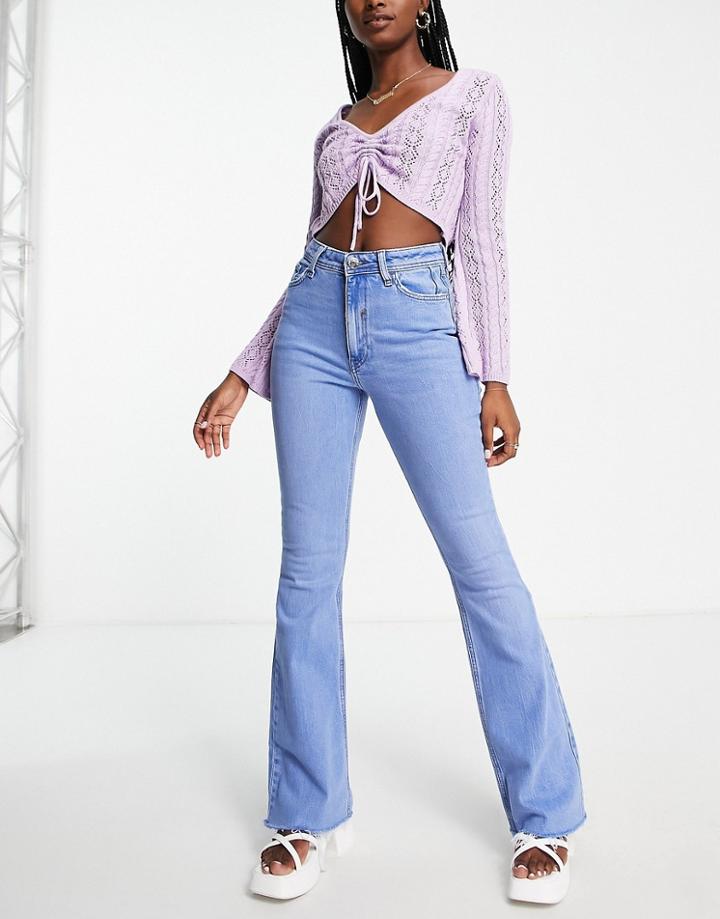 River Island Raw Hem Flared Jeans In Mid Blue