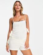 The Frolic Flora Beach Romper With Tie Detail In Cream Waffle-white