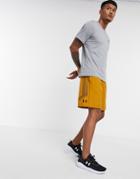 Under Armour Training Woven Graphic Shorts In Mustard-yellow