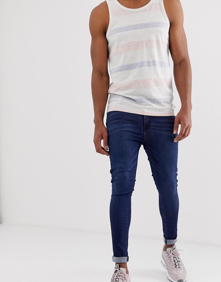 Asos Design Spray On Jeans In Power Stretch Denim In Dark Wash Blue - Blue