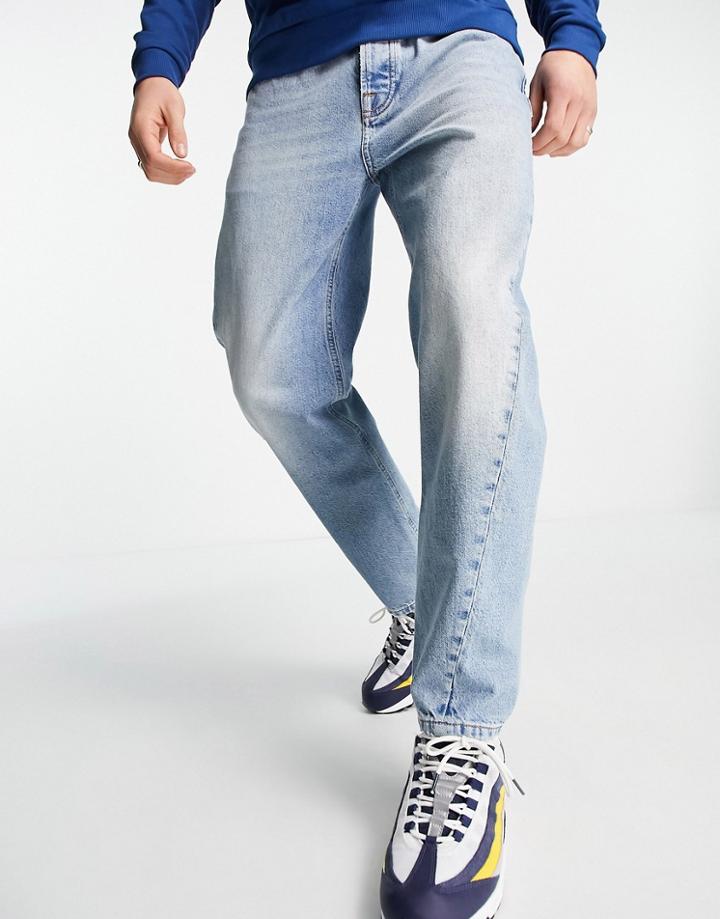 Topman Tapered Curved Leg Jeans In Light Wash Blue