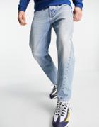 Topman Tapered Curved Leg Jeans In Light Wash Blue