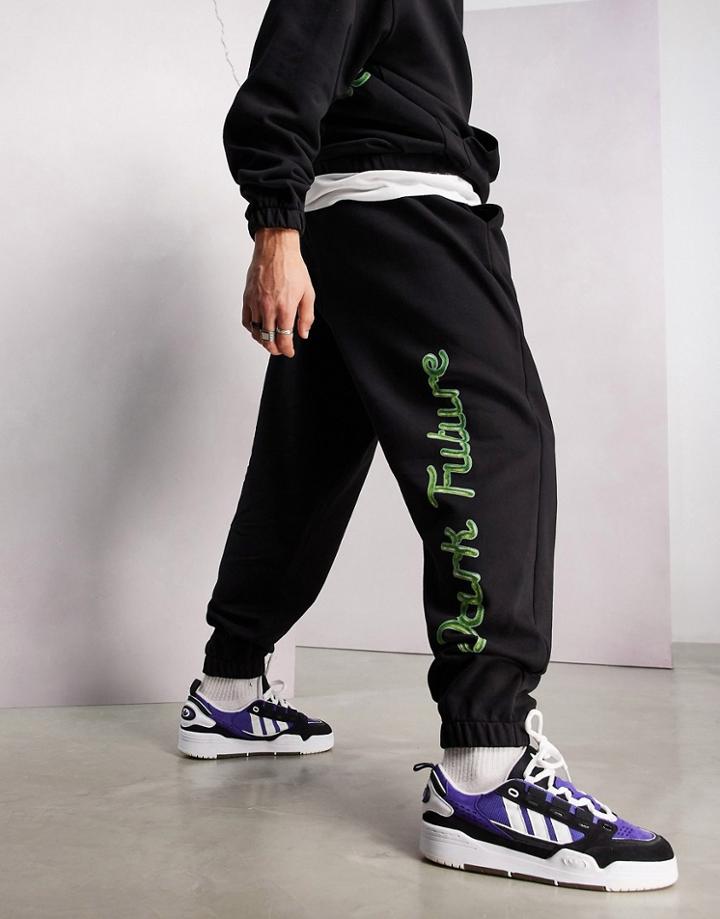 Asos Dark Future Oversized Sweatpants With Bubble Graphic Logo Print In Black - Part Of A Set