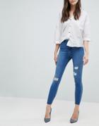 Asos Ridley High Waist Skinny Jeans In Pretty Mid Wash With Rip And Repair And Reverse Stepped Hem - Blue