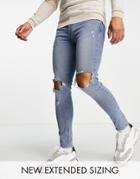 Asos Design Spray On Jeans In Power Stretch In Mid Wash With Knee Rips And Abrasions-blues