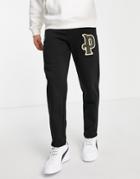 Puma Varsity Logo Sweatpants In Black