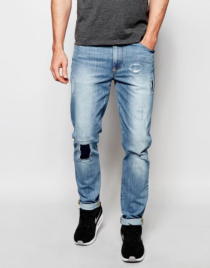 Asos Skinny Jeans In Light Wash With Rip And Repair Patches - Mid Blue