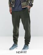 Asos Tapered Joggers With Print Pocket In Khaki - Green