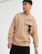Asos Design Oversized Sweatshirt With Cargo Chest Pocket In Stone & Text Print-beige