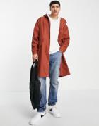 Asos Design Shower Proof Rubberized Rain Jacket In Rust-copper