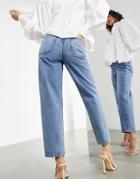 Asos Edition Tapered Jeans With Twisted Seam In Mid Wash-blues