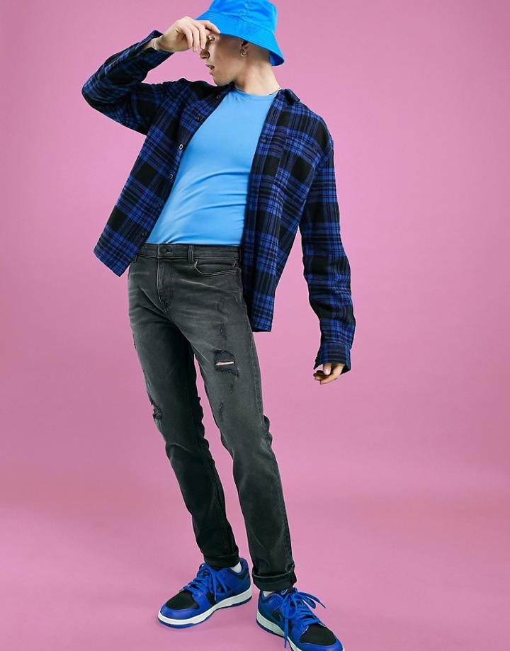Asos Design Skinny Jeans In Washed Blackwith Rips