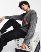 Jaded London Oversized Long Sleeve T-shirt In Acid Wash Black With Energy Orb Print