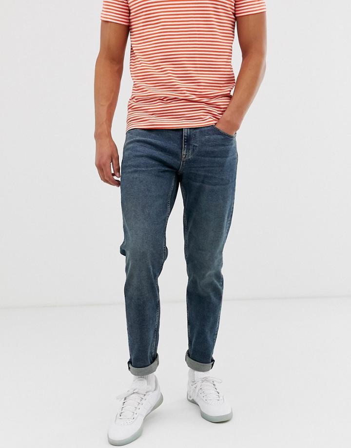 Asos Design Tapered Jeans In Vintage Dark Wash Blue