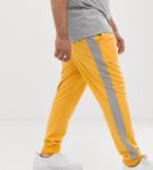 Asos Design Plus Skinny Sweatpants In Poly Tricot With Side Stripe In Yellow - Yellow