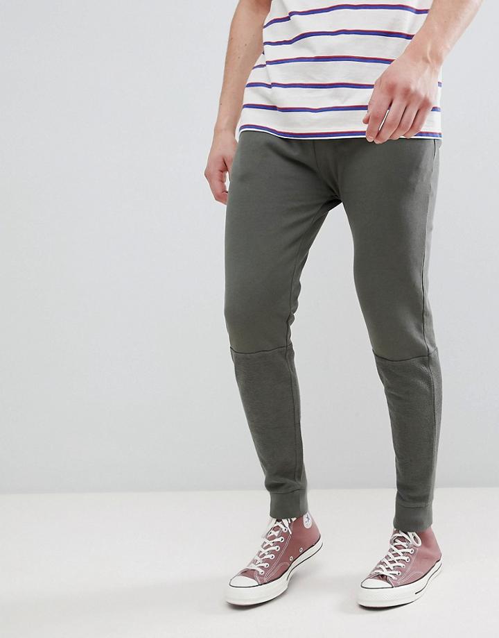 Asos Design Skinny Joggers In Khaki Vintage Wash With Cut And Sew Panel - Green