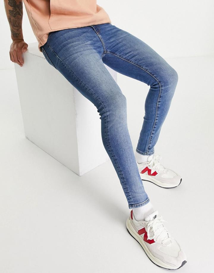 Asos Design Spray On Jeans With Powerstretch In Vintage Mid Wash-blues