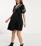 Asos Design Maternity Mini Wrap Dress With Short Puff Sleeves And Tiered Hem And Shoulder Embroidery In Black