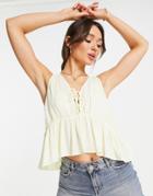 Asos Design Crinkle Cami With Lace-up Front And Peplum Hem In Lemon-yellow