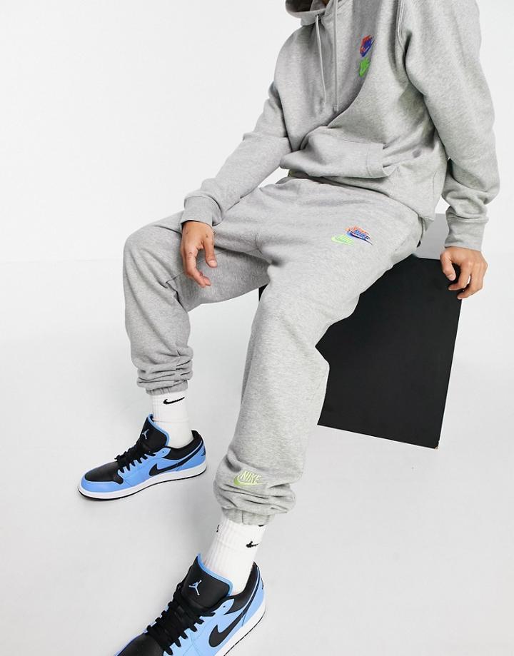 Nike Essential Fleece+ Multi Logo Casual Fit Cuffed Sweatpants In Gray-grey