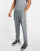 Nike Running Dri-fit Stripe Woven Pants In Gray-grey