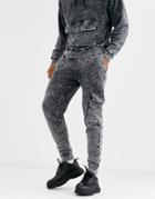 Asos Design Two-piece Tapered Sweatpants With Cargo Pockets In Acid Wash-black