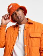 Asos Design Y2k Fluffy Bucket Hat With Badge In Orange