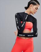Ivy Park Active Logo Long Sleeve Cutaway Top In Black - Black